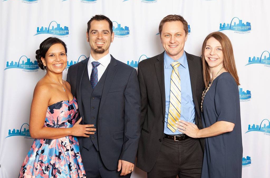 two couples in red carpet attire at the Hispanic Chamber of Commerce Adelante Awards event